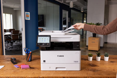 Person Placing Paper to be Scanned