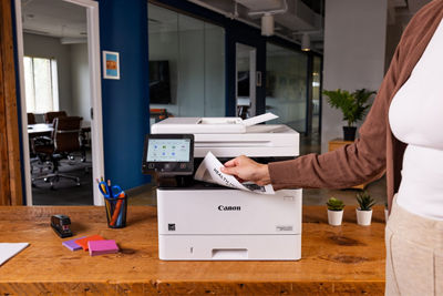 Person Retriving Paper from imageCLASS MF465dw II