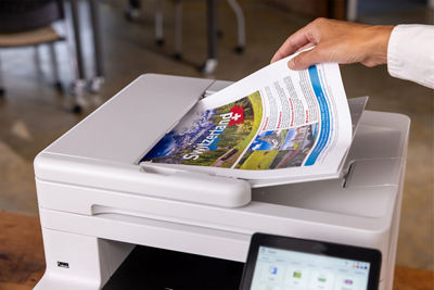 Person Using the Top Paper Feeder of the imageCLASS MF665Cdw