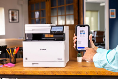 Person Connecting Mobile Phone to imageCLASS MF751Cdw II