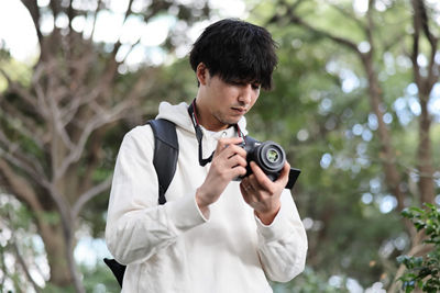 Person Holding an EOS R Camera