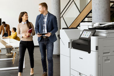 Man and woman in office with a imageFORCE Series printer