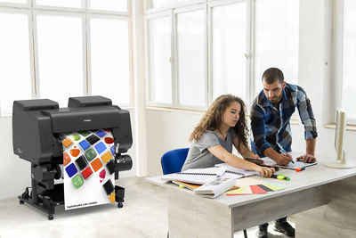 man and woman working with the imagePROGRAF GP-2600S 