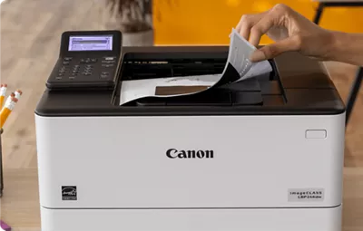 imageCLASS LBP246dw - Person Using Paper Feeder to Scan