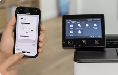 imageCLASS LBP247dw - Person Holding Mobile Phone In Front of Printer