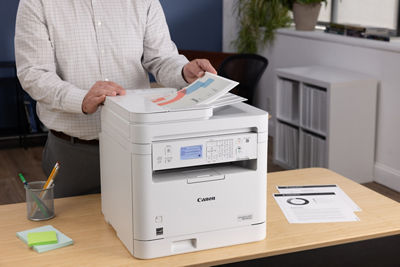 imageCLASS MF284dw - Person Using Top Document Feeder