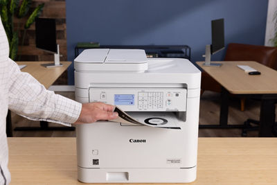 imageCLASS MF284dw - Person Retrieving Printed Paper