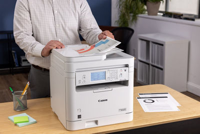 imageCLASS MF287dw - Person Using Top Document Feeder