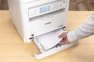 imageCLASS MF289dw - Person Loading Paper into Tray