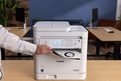 imageCLASS MF289dw - Person Retrieving Printed Paper