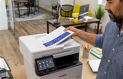 imageCLASS MF465dw - Person Using Paper Feeder to Scan