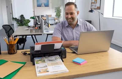 imageFORMULA DR-M1060II - Person Scanning Document