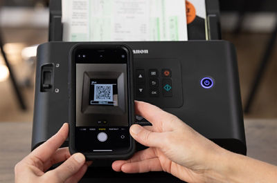 imageFORMULA DR-S250N - Person Scanning QR Code