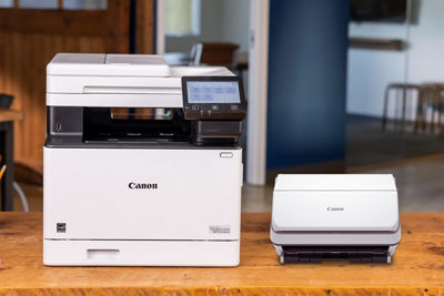 Canon Printer and Canon Scanner Next to Each Other on a Table