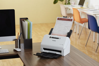 Photo of Canon scanner on a desk.