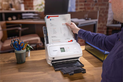 Person Scanning a Paper