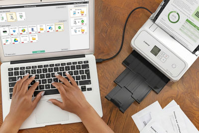 Person using a Laptop to Scan with the imageFORMULA R40II Receipt Edition