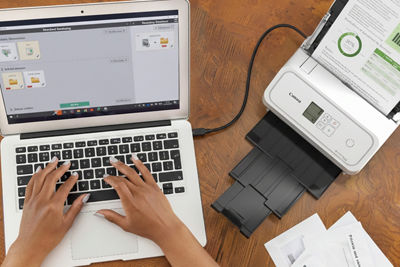 Person Using a Laptop to Scan Documents with imageFORMULA R40II