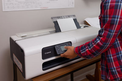 Person Tilting the Screen of the imagePROGRAF TC-21