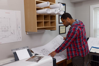 Person Looking at Printed Document from the imagePROGRAF TC-21