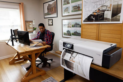 Person in a Home Office Printing with the imagePROGRAF TC-21M