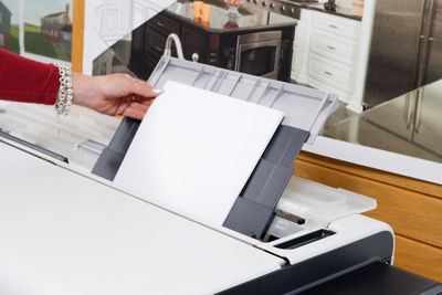 Person Loading Up 11" x 17" Paper On the imagePROGRAF TC-21M