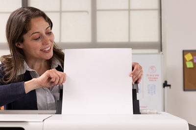 Person Using the Automatic Paper Feeder on the imagePROGRAF TC-21M