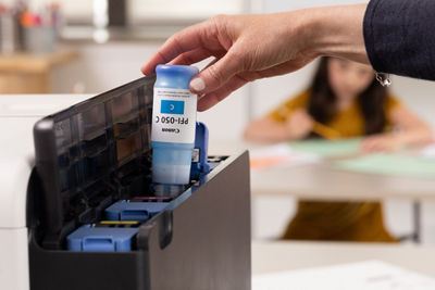 Person Filling Ink Tank of the imagePROGRAF TC-21M