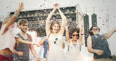 Group of people celebrating with confetti all around them