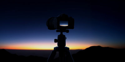 camera on a mount focused on a sunrise/sunset