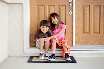 Siblings Sitting Next to Each Other