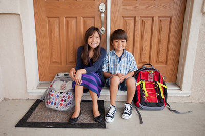 Siblings Sitting Next to Each Other