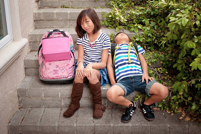 Siblings Sitting Next to Each Other