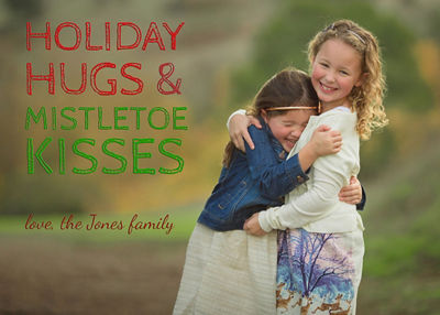 holiday card featuring two girls hugging
