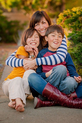 family sitting on ground