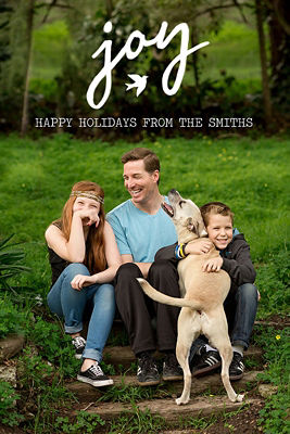 holiday card featuring family and their dog