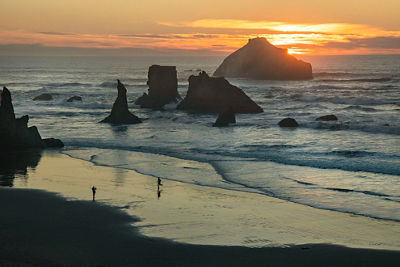 Coastal image of an orange sunset at Bandon Beach