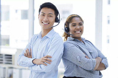 Two Customer Service Representatives Back to Back