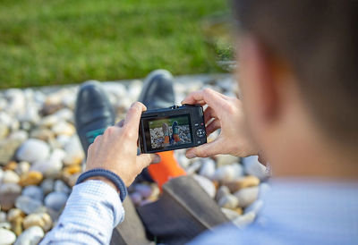 Man looking at camera settings