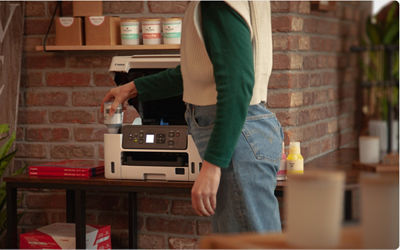 MAXIFY GX3020 - Person Filling an Ink Tank