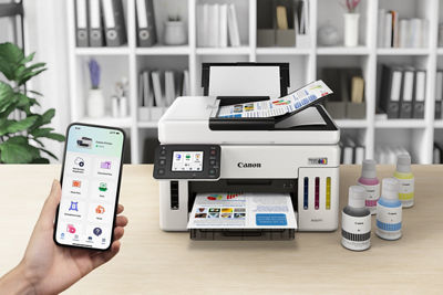 MAXIFY GX6110 - Person Using Phone to Print