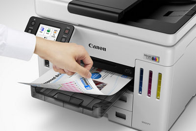 MAXIFY GX7110 - Person Grabbing Printed Paper