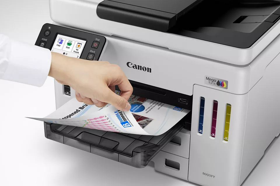 MAXIFY GX7110 - Person Grabbing Printed Paper