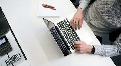 man working on a laptop computer