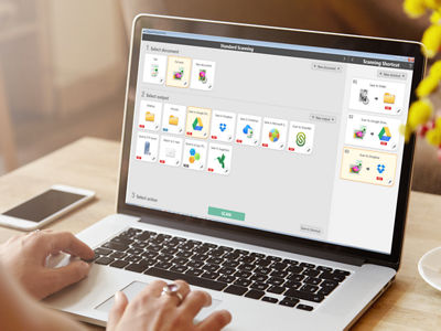 Photo of a person typing on a laptop.