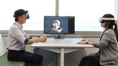 People Sitting with MREAL Headsets Designing Something Virtually