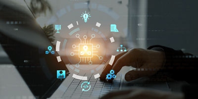 Image of man working with a laptop