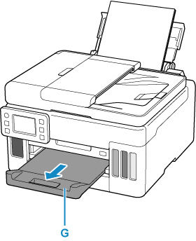 Pull out the paper output tray (G)