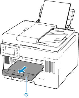 Pull out the paper output tray (G)