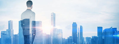 Overlay of a man looking at a city skyline